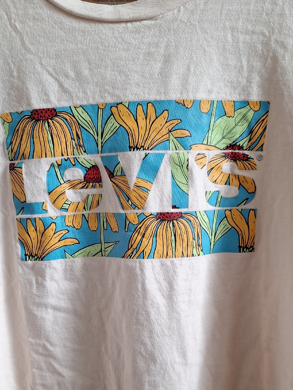 Levi's White Tee with Blue Background and Yellow Floral Box Logo